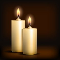 Two burning candles on black background