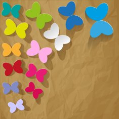 Colored paper butterflies on a crumpled brown background