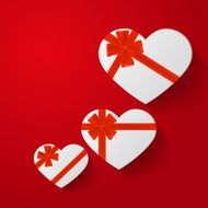 Heart-shaped gifts with red bow