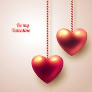 Three dimensional hanging hearts on light background