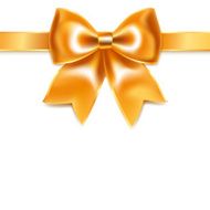 Golden bow of silk ribbon isolated on white background