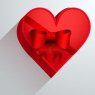 Gift box with red ribbon in the form of heart