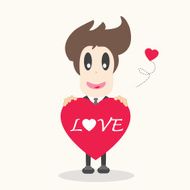 Businessman holding a red heart