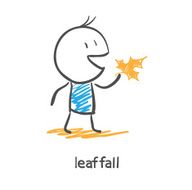 Man holding an autumn leaf