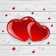 Two hearts on wooden background
