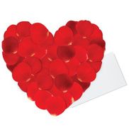 Heart of red petals and blank white paper