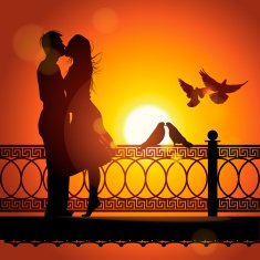 Silhouette of couple in love kissing at sunset