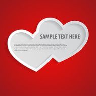 Two connected hearts cut out of red paper