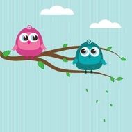 Cute birds on the tree branch