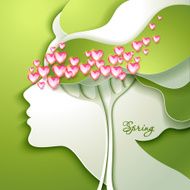 Beautiful young woman with flowers in hair