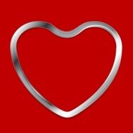 Metal heart on red background