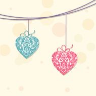 Happy Valentines Day celebration with hanging hearts