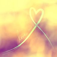 Love yellow ribbon background on blurred vintage bokeh