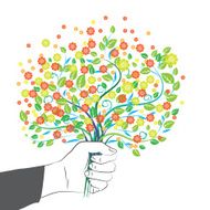 Hand holding colorful flower