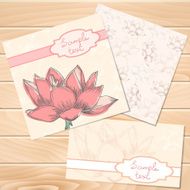 Set of floral vintage wedding cards on wood texture