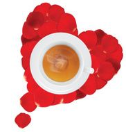 Cup of hot tea in the heart rose petals