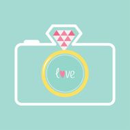 Blue photo camera with gold wedding ring lens Diamond flash