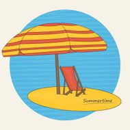 Beach umbrella and deckchair on the beach