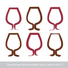 Set of hand-painted simple empty brandy glasses isolated