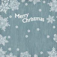 Christmas greetings with snowflakes on wooden texture Vector il