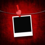 photo hanging on clothesline with heart clothespin