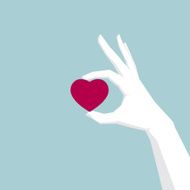 Hand holding heart symbo