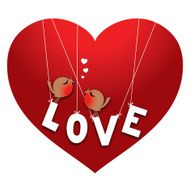 Two cute love birds perched on the word LOVE