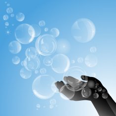 Silhouette of female hands with soap bubbles