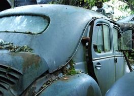 Rear view of a car in a car cemetery