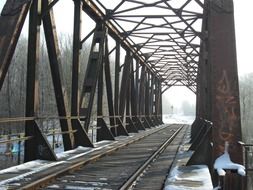 railroad under the bridge in winter