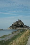 distant view of the cathedral on the island of mont saint michel