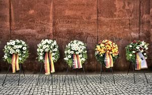 wreaths near the brick wall