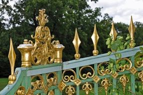 fence with gold accents near the castle