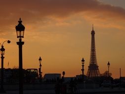 street lights against the eiffel tower at dusk, france, paris