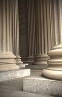 the foot of the marble columns