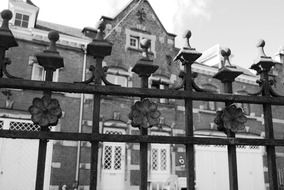 black and white photo of the metal fence