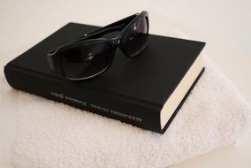 sunglasses and book