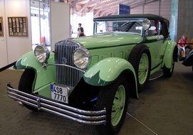 green retro car in museum