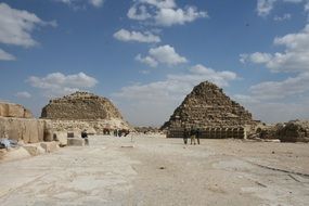 tourists at the foot of the Egyptian pyramids