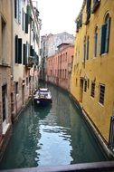 canal between houses, italy, venice