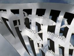 photo of the fishes sculptures on a bridge