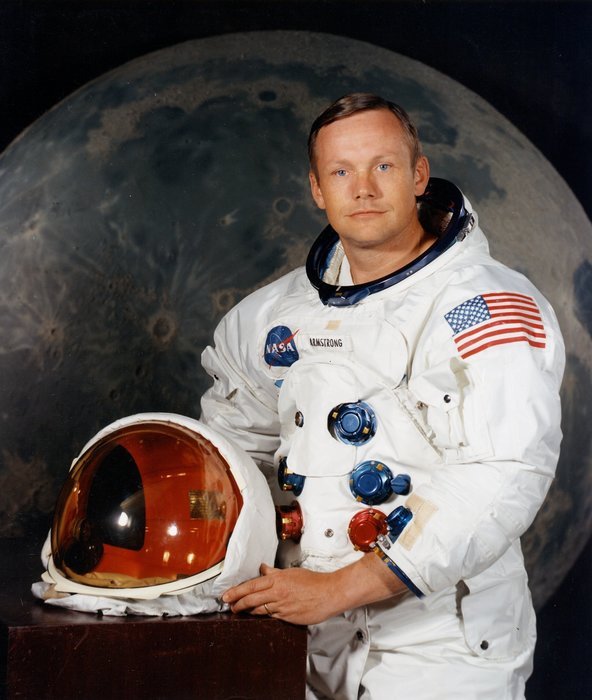 young niel armstrong in a space suit with a background of the moon