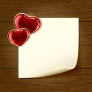 Wooden background with paper and heart