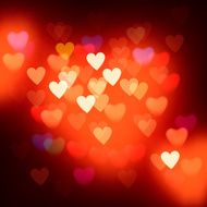 Blurred defocused lights background with hearts