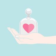 Hand offering a heart under glass cover N2