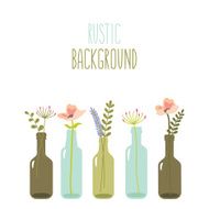 Rustic flowers in glass bottles