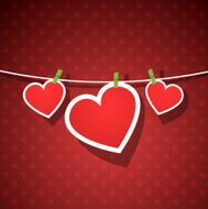 Paper hearts hanging from a rope N3