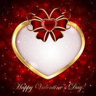 Golden heart with red bow