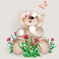 Happy Teddy bear sits in a meadow flowers