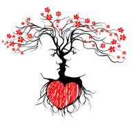 Silhouette of kissing couple shaped by tree